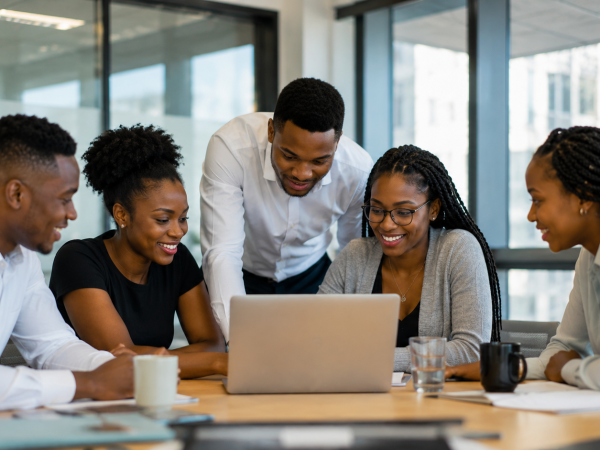 Young South African interns working together in a modern office during a paid internship programme
